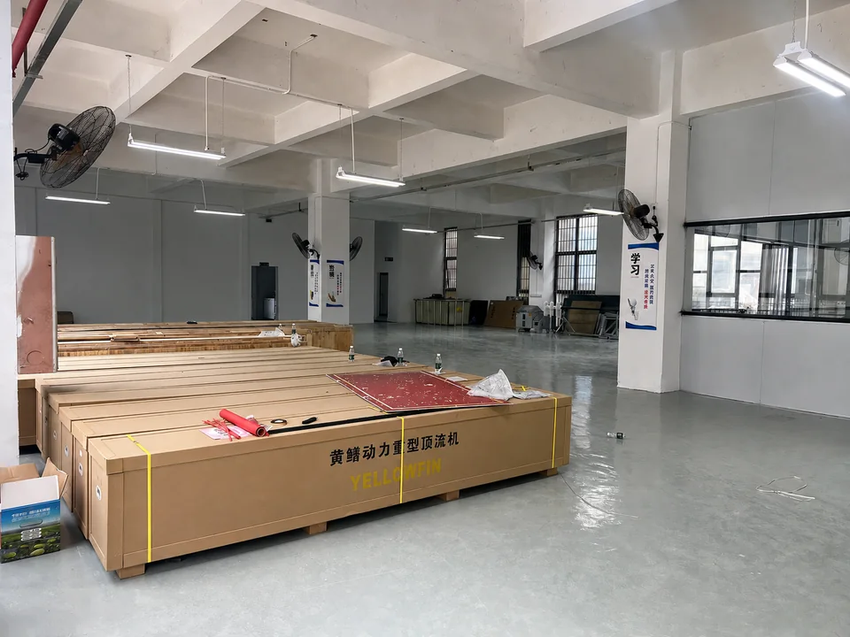 YELLOWFIN product packaging area with wooden crates marked for heavy-duty trolling motors